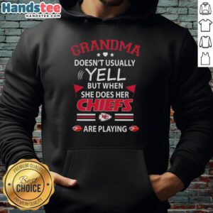 Nice grandma in a Kansas City Chiefs hoodie, expressing excitement during a football game.