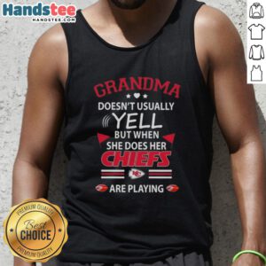 Nice grandma in a Kansas City Chiefs tank top, passionately cheering during a football game, showcasing her playful side.