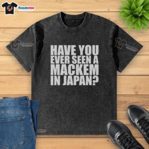 Nice Have You Ever Seen A MACkem In Japan washed t-shirt displayed on a mannequin in a vibrant street market setting.