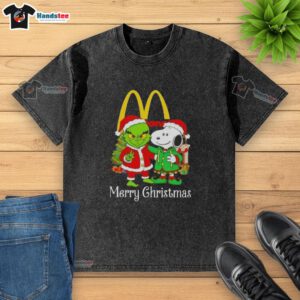 Alt Text: Nice McDonald's X Grinch and Snoopy Merry Christmas washed t-shirt featuring festive graphics and vibrant colors.