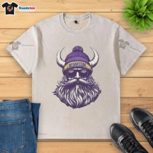Alt Text: Minnesota Vikings mascot in a beanie and sunglasses, showcasing a washed t-shirt for a fun, sporty vibe.