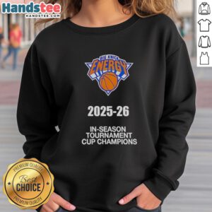 New York Knicks 2025-26 In Season Tournament Cup Champions sweatshirt featuring team logo and vibrant colors.