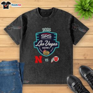 Official Nebraska Cornhuskers vs Utah Utes 2025 Las Vegas Bowl washed t-shirt displayed at Allegiant Stadium.