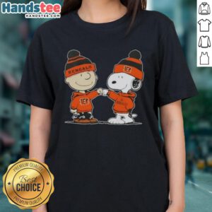 Charlie Brown and Snoopy fist bump in Cincinnati Bengals football ladies tee featuring Nice Peanuts design.