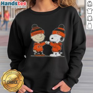 Charlie Brown and Snoopy fist bump in Cincinnati Bengals sweatshirt, showcasing a fun Nice Peanuts design for football fans.