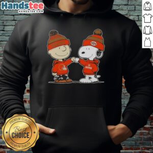 Alt Text: Charlie Brown and Snoopy giving a fist bump in a Cleveland Browns football hoodie, showcasing Nice Peanuts style.