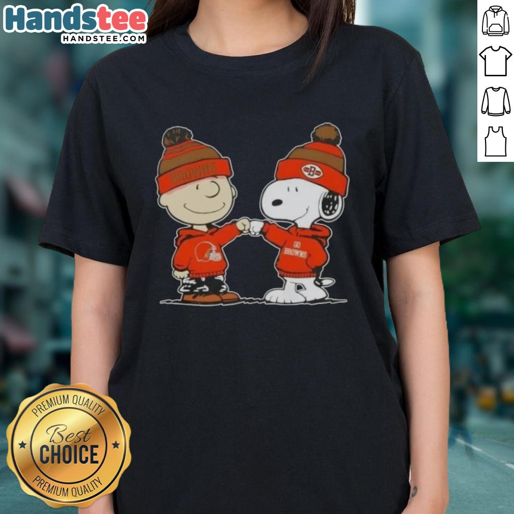 Charlie Brown and Snoopy fist bump in Cleveland Browns gear on a ladies tee, celebrating friendship and football fun.