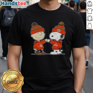 Charlie Brown and Snoopy fist bump on a Cleveland Browns football T-shirt featuring Nice Peanuts design.
