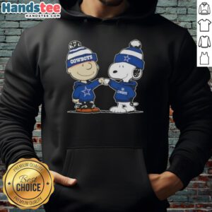 Charlie Brown and Snoopy fist bump in a Dallas Cowboys football hoodie, celebrating friendship and team spirit.