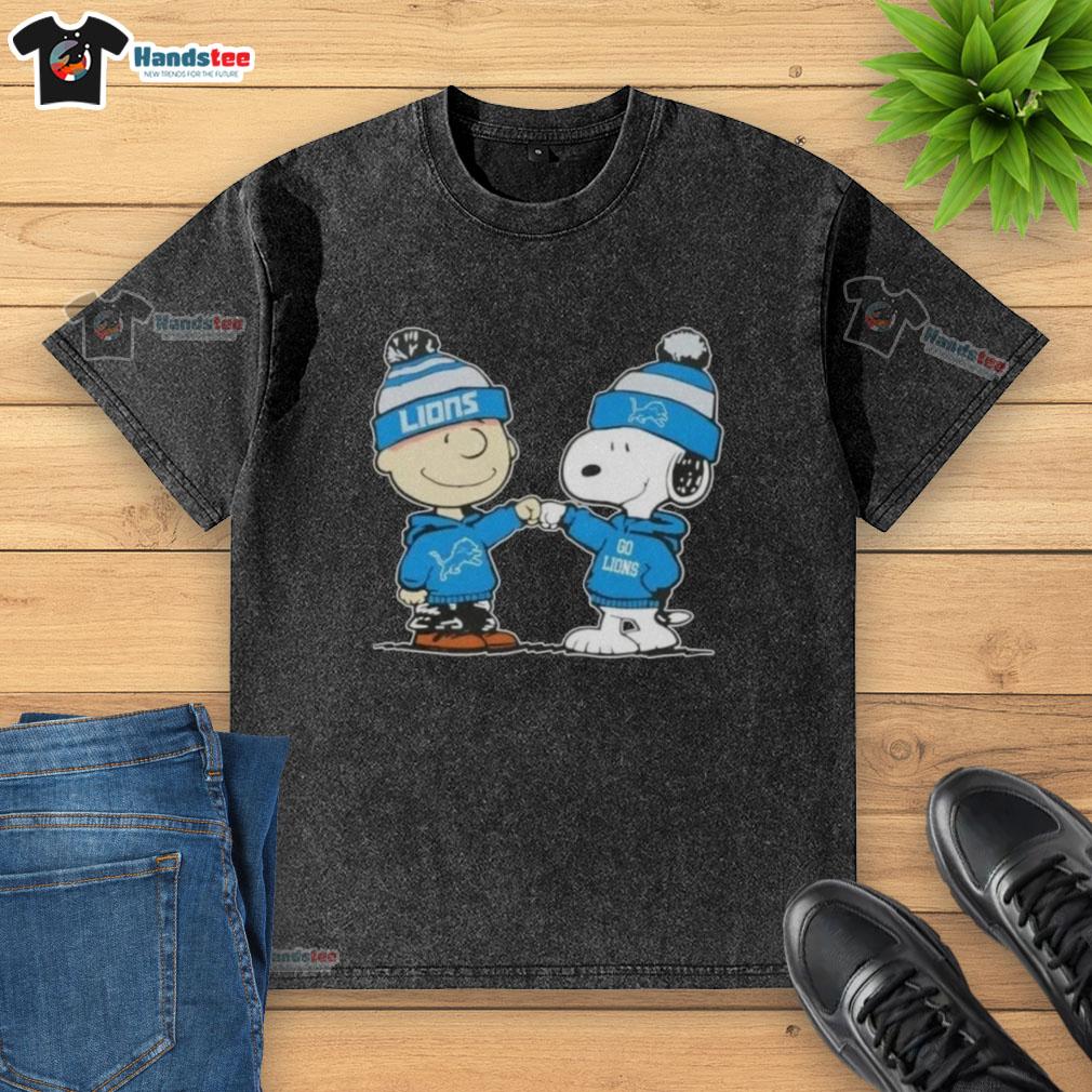 Charlie Brown and Snoopy fist bump in a washed t-shirt featuring Detroit Lions football design, perfect for fans.