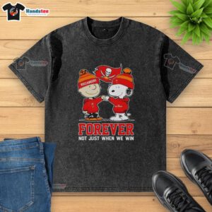 Tampa Bay Buccaneers X Charlie Brown vs Snoopy Forever t-shirt, showcasing a fun sports-themed design.