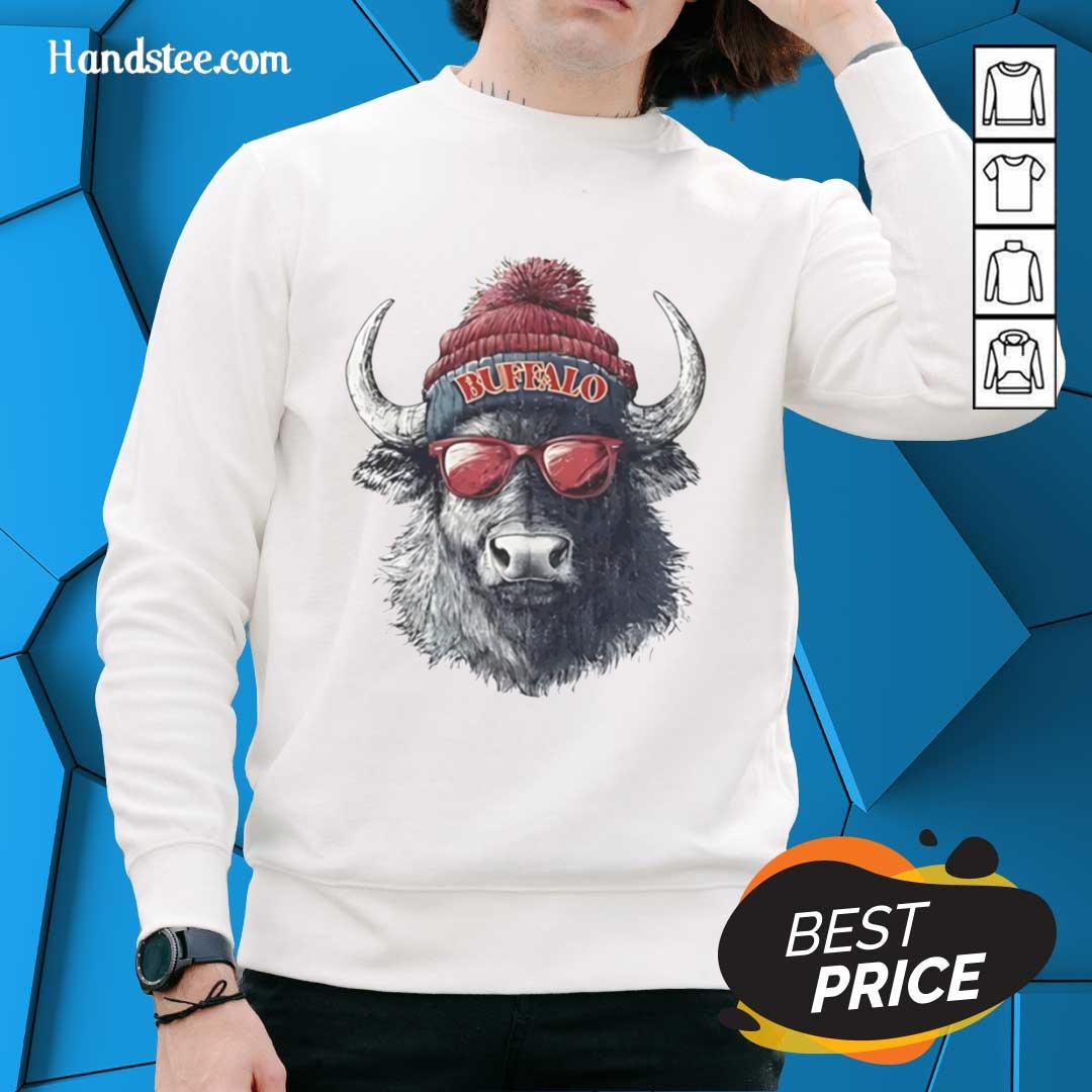 Alt Text: Official Buffalo Bills mascot sporting a beanie, sunglasses, and a sweatshirt, showcasing team spirit and style.