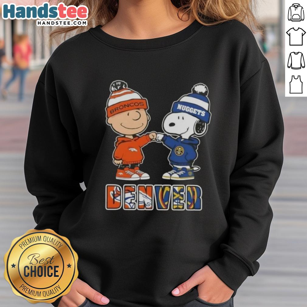 Official Charlie Brown fist bump with Snoopy on Denver City Sports Broncos X Nuggets sweatshirt, perfect for fans.