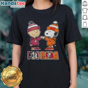 Official Charlie Brown Fist Bump tee featuring Snoopy, perfect for Florida City sports fans, Seminoles & Buccaneers.