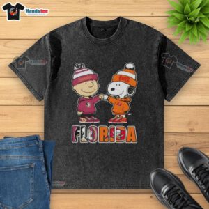 Official Charlie Brown fist bump with Snoopy on Florida City sports Seminoles and Tampa Bay Buccaneers washed t-shirt.