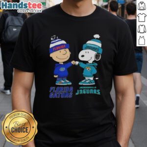 Official Charlie Brown Fist Bump Snoopy T-Shirt featuring Florida Gators and Jacksonville Jaguars design.
