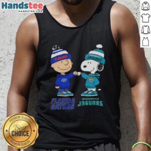 Official Charlie Brown fist bump with Snoopy on Florida Gators x Jacksonville Jaguars tank top design.