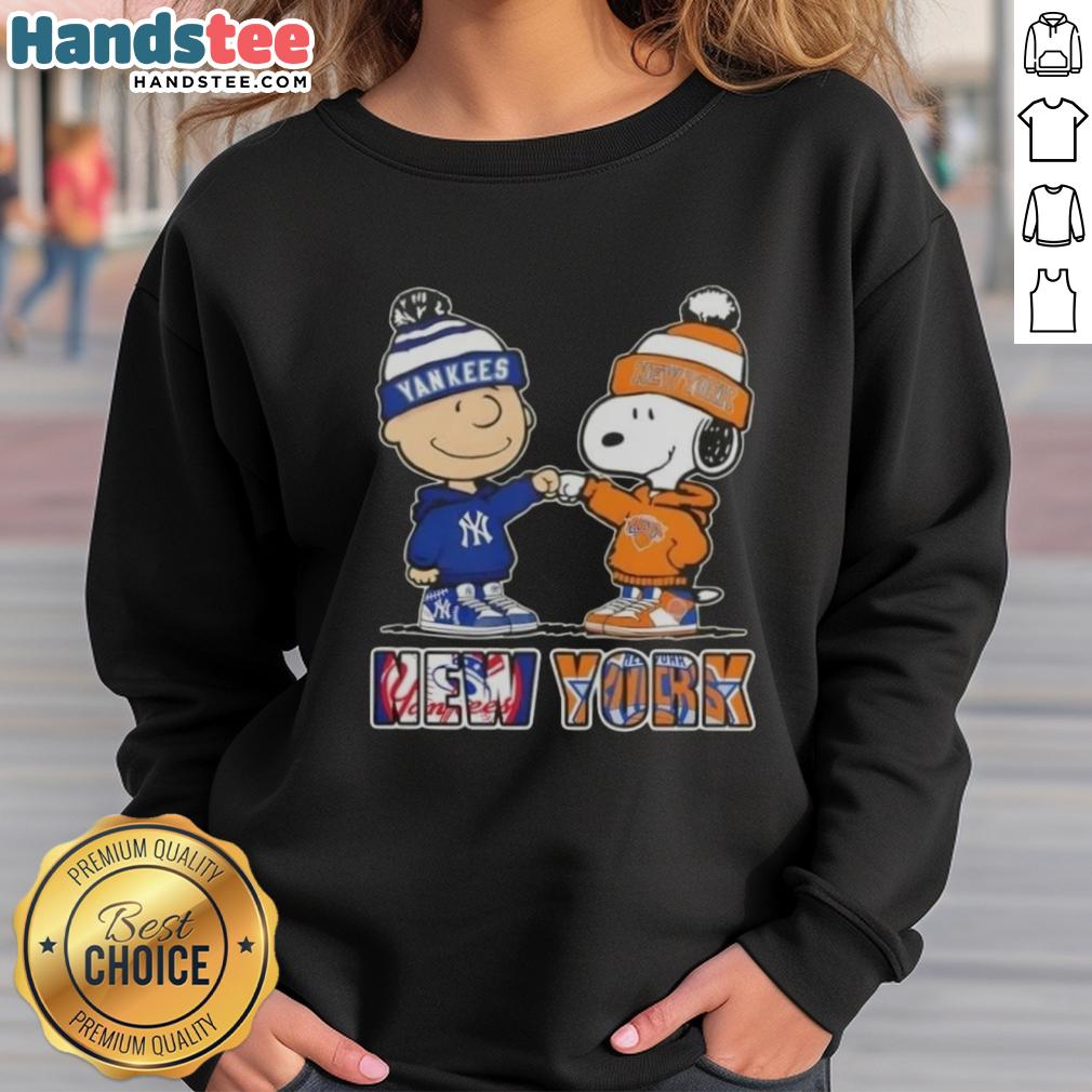 Official Charlie Brown fist bump with Snoopy on a Yankees and Knicks sweatshirt, perfect for NYC sports fans.