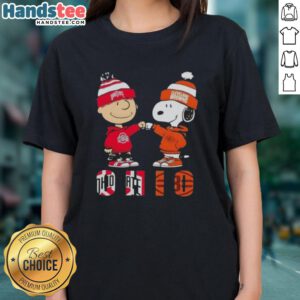 Official Charlie Brown fist bump with Snoopy, featuring Ohio City Sports, Buckeyes, and Cleveland Browns ladies tee design.