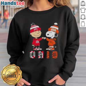 Official Charlie Brown fist bump with Snoopy on Ohio City sports sweatshirt featuring Buckeyes and Cleveland Browns design.