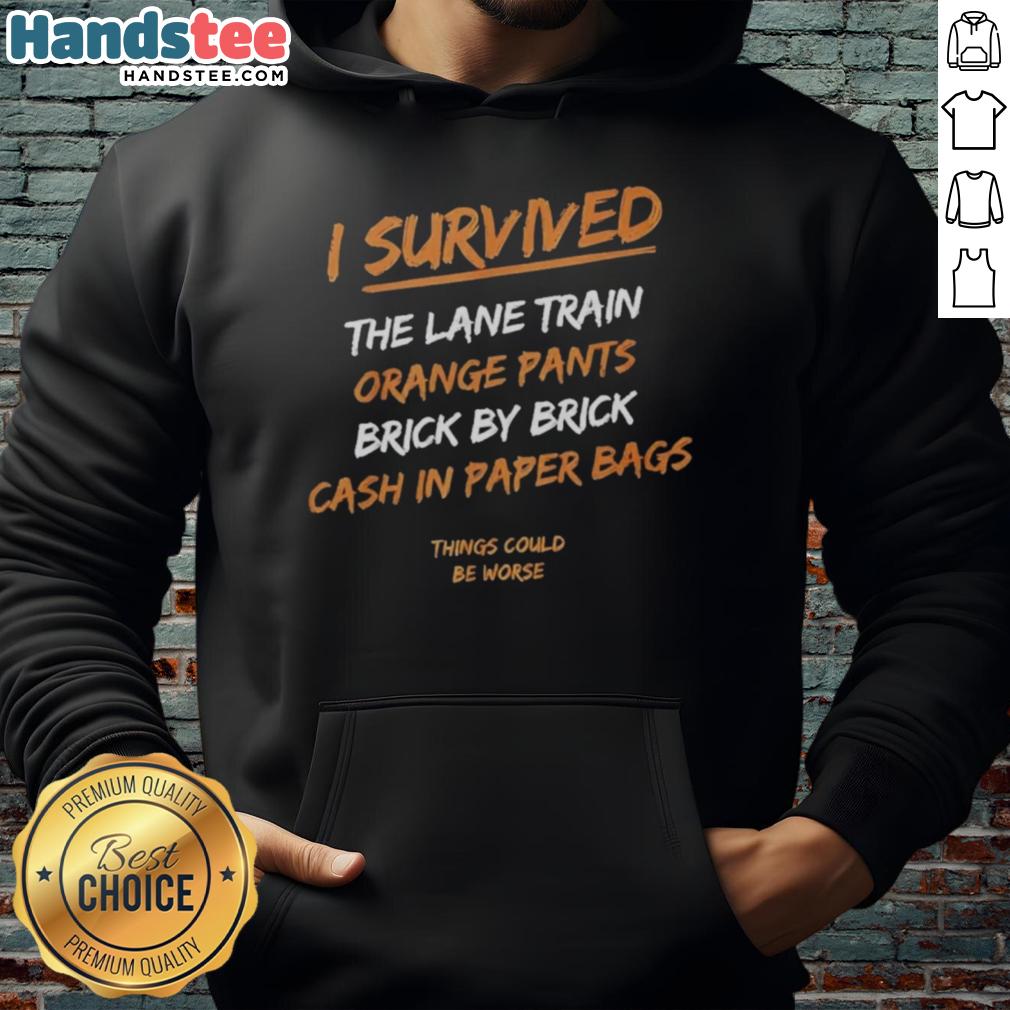 Official I Survived The Lane Train hoodie in orange pants, featuring Brick By Brick design and cash-in paper bags.