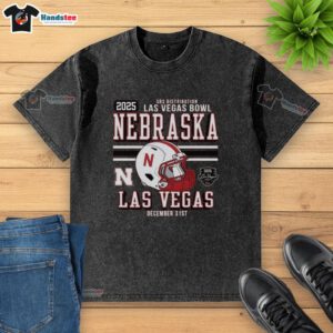 Official Nebraska Huskers Football 2025 Las Vegas Bowl Bound helmet graphic on a washed t-shirt, perfect for fans.