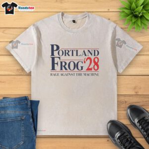 Official Portland Frog 2028 Rage Against The Machine washed t-shirt featuring vibrant graphics and a relaxed fit.