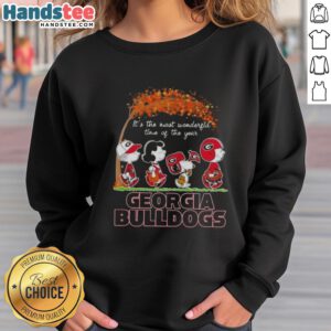 Premium Georgia Bulldogs X Peanuts Snoopy sweatshirt celebrating autumn and the holidays, perfect for fans and festive cheer.