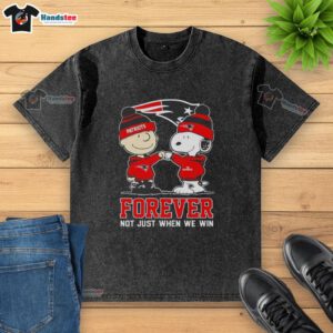 Cute Peanut Snoopy and Charlie Brown on a New England Patriots Forever t-shirt, celebrating fandom beyond victories.