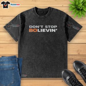 Good Don't Stop Believin' Denver Broncos football washed t-shirt featuring vintage design and team colors.