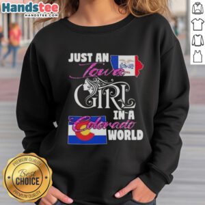 Woman wearing 'Good Just An Iowa Girl In A Colorado World' sweatshirt, showcasing a stylish blend of Midwest and mountain vibes.