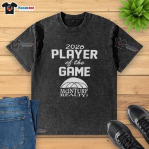 Good Mcinturf Realty 2026 Player of the Game washed t-shirt featuring vibrant design and comfortable fit.