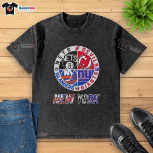 Alt Text: Good New York City sports logos on a washed t-shirt featuring Nets, Devils, Giants, and Islanders designs.