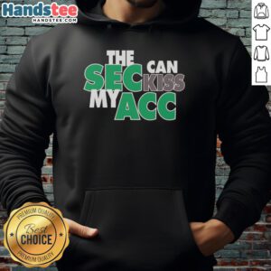 Happy Miami Hurricanes fan wearing 'SEC Can Kiss My ACC' hoodie, showcasing team spirit and pride at a game.