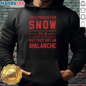 Group wearing 'Nice They Prayed For Snow' hoodies in Ann Arbor, MI, amid a snowy avalanche scene on Nov 29, 2025.