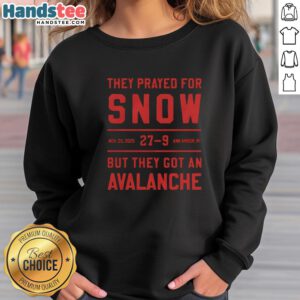 Cozy 'Nice They Prayed For Snow' sweatshirt in snowy Ann Arbor, MI, perfect for winter adventures and avalanche enthusiasts.