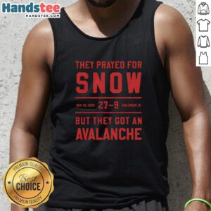People in Ann Arbor, MI, wearing 'Nice They Prayed For Snow' tank tops during an unexpected avalanche on Nov 29, 2025.