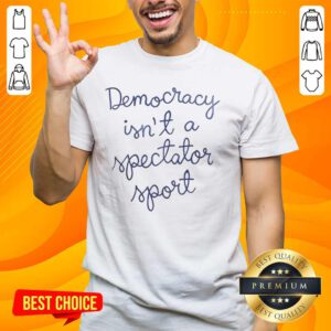 Official Democracy Is Not A Spectator Sport Nicolle Wallace T-Shirt featuring bold text design on a stylish fabric.