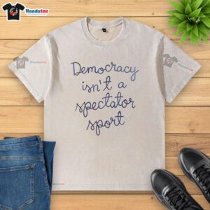 Official Democracy Is Not A Spectator Sport Nicolle Wallace washed t-shirt featuring bold text for political activism.