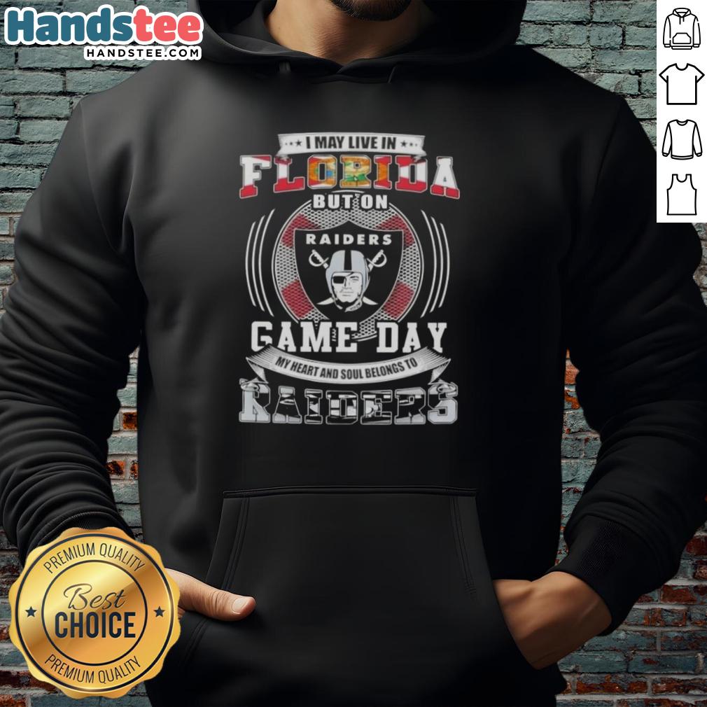 Fan wearing 'I May Live In Florida But On Game Day My Heart Belongs To Las Vegas Raiders' hoodie at a football game.