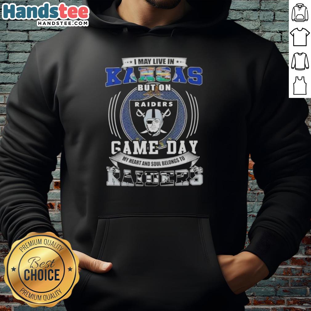 Person wearing a 'I May Live In Kansas But On Game Day My Heart And Soul Belongs To Las Vegas Raiders' hoodie.