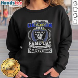 Alt Text: Cozy sweatshirt featuring I May Live In Oregon But On Game Day My Heart Belongs To Las Vegas Raiders Football.