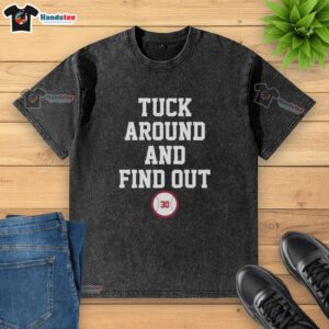 Premium Tuck Around and Find Out Kyle Tucker 30 Los Angeles Dodgers baseball washed t-shirt displayed on a wooden background.