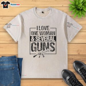 Vintage washed t-shirt with 'I Love One Woman And Several Guns' graphic, perfect for casual wear and gun enthusiasts.