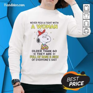 Nice Peanuts Snoopy sweatshirt with a funny quote about women over 60 and their fierce nature.