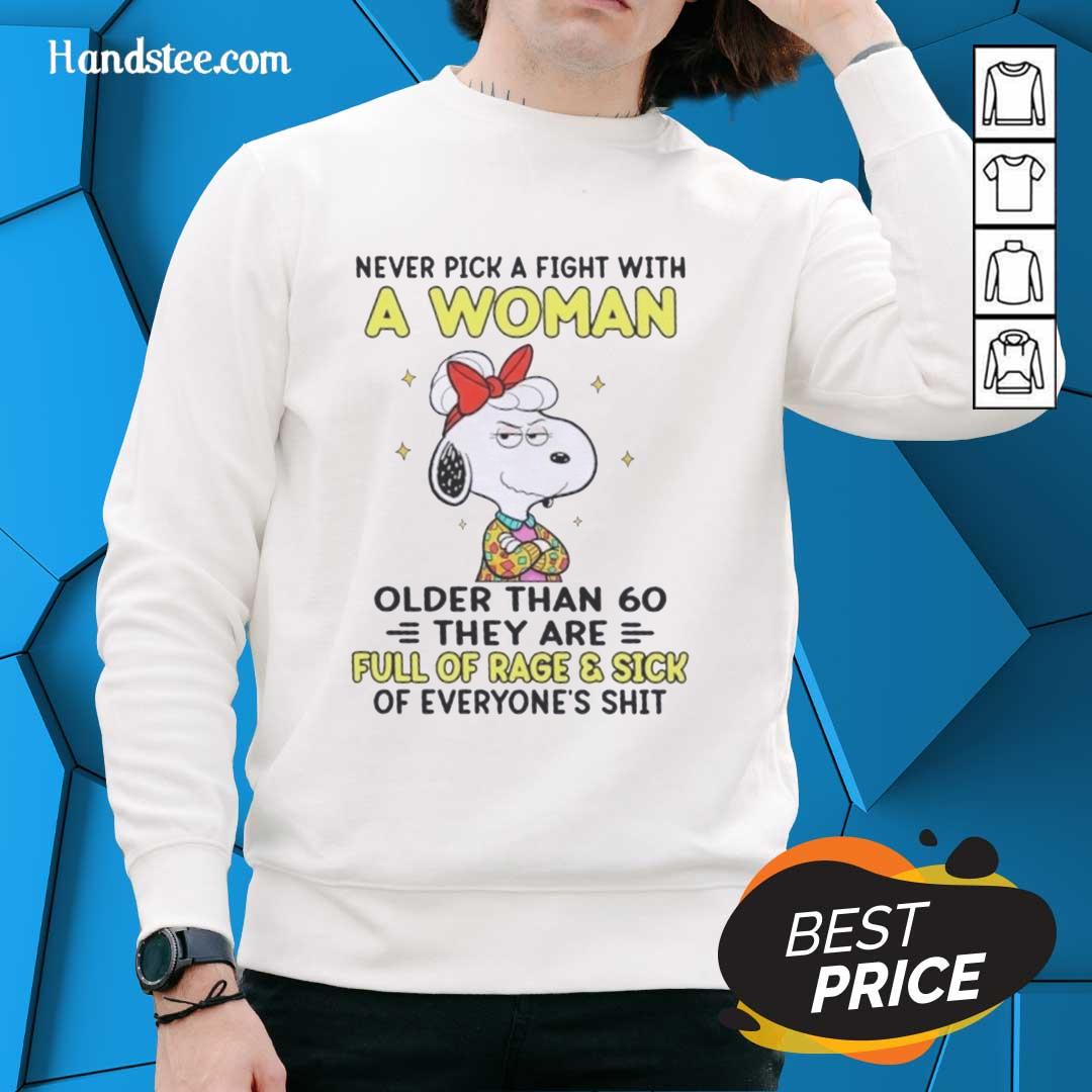 Nice Peanuts Snoopy sweatshirt with a funny quote about women over 60 and their fierce nature.