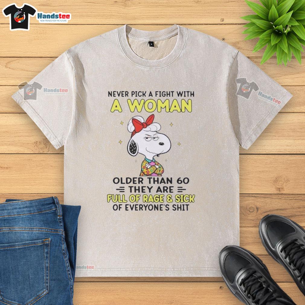 Alt Text: Nice Peanuts Snoopy shirt featuring the quote about women over 60, highlighting humor and style in a washed t-shirt.