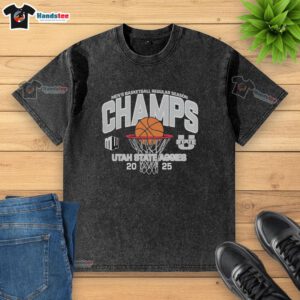 Official Utah State Aggies Men's Basketball 2025 Mountain West Champions washed t-shirt featuring team logo and colors.