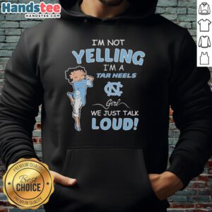 Alt Text: North Carolina Tar Heels girl wearing a hoodie with the phrase I'm not yelling, we just talk loud in vibrant colors.