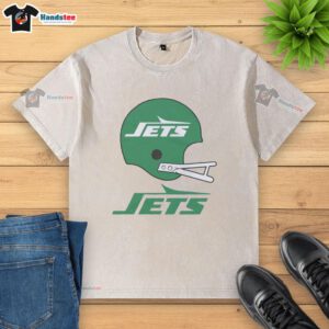 Alt Text: Awesome New York Jets football logo displayed on a big helmet graphic on a washed t-shirt. Perfect for fans!